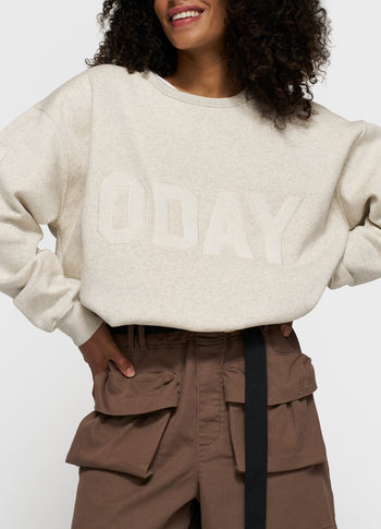 statement sweater logo patch | soft white melee