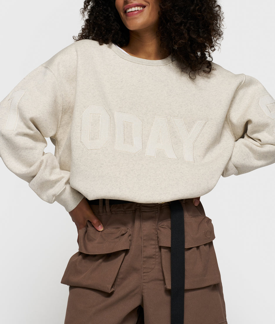 statement sweater logo patch | soft white melee