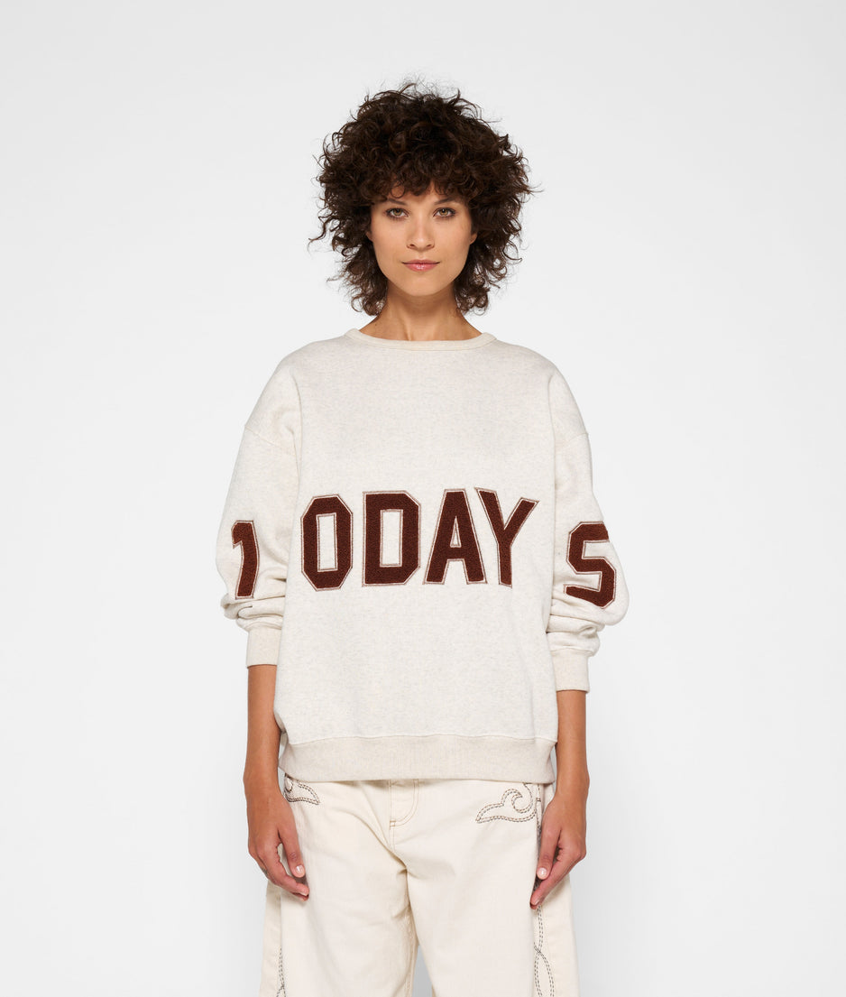 statement sweater logo | soft white melee