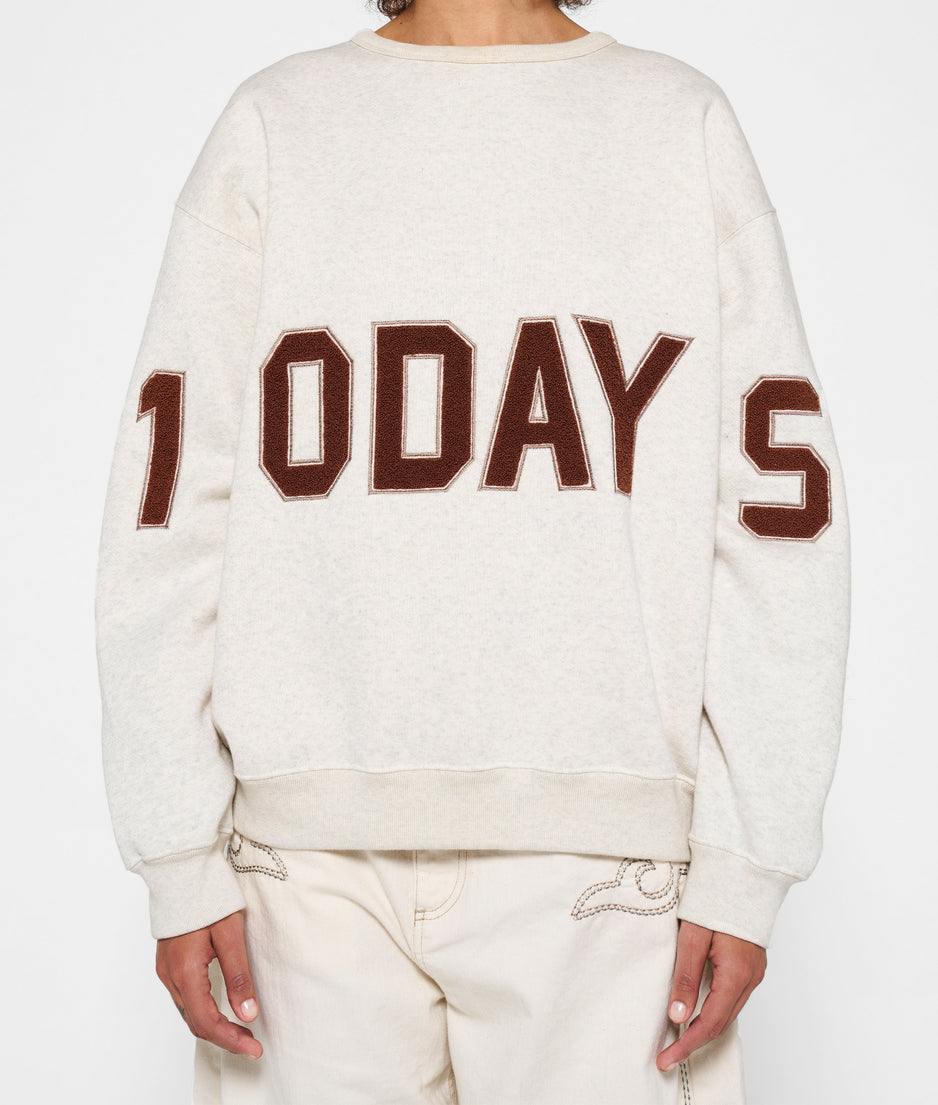 statement sweater logo | soft white melee
