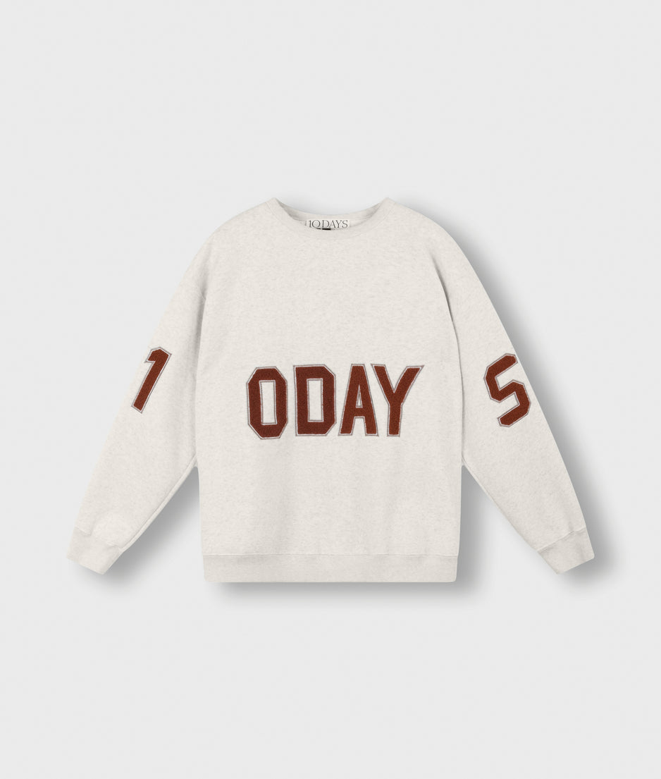 statement sweater logo | soft white melee