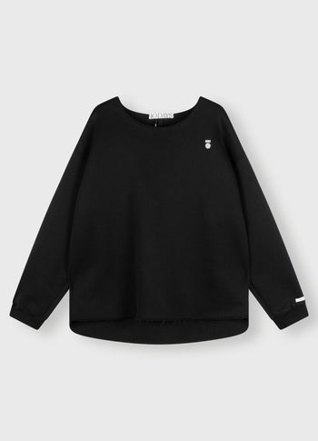 raw edge statement sweater | black