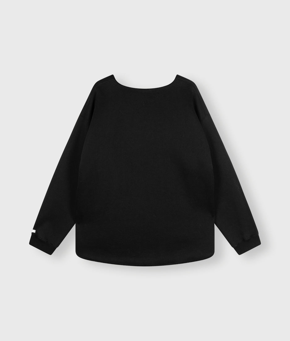 raw edge statement sweater | black