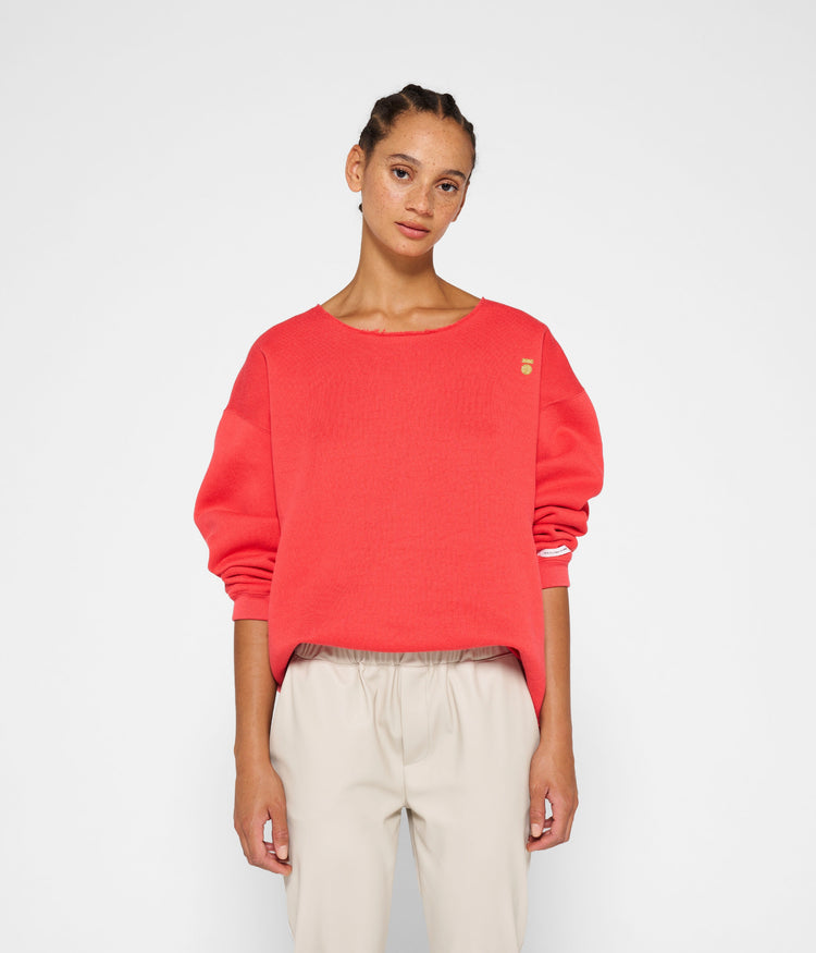 raw edge statement sweater | coral red