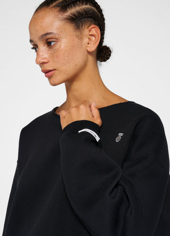 raw edge statement sweater | black