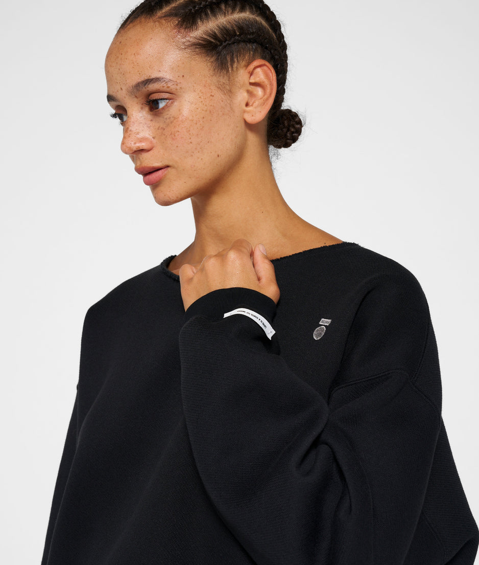 raw edge statement sweater | black
